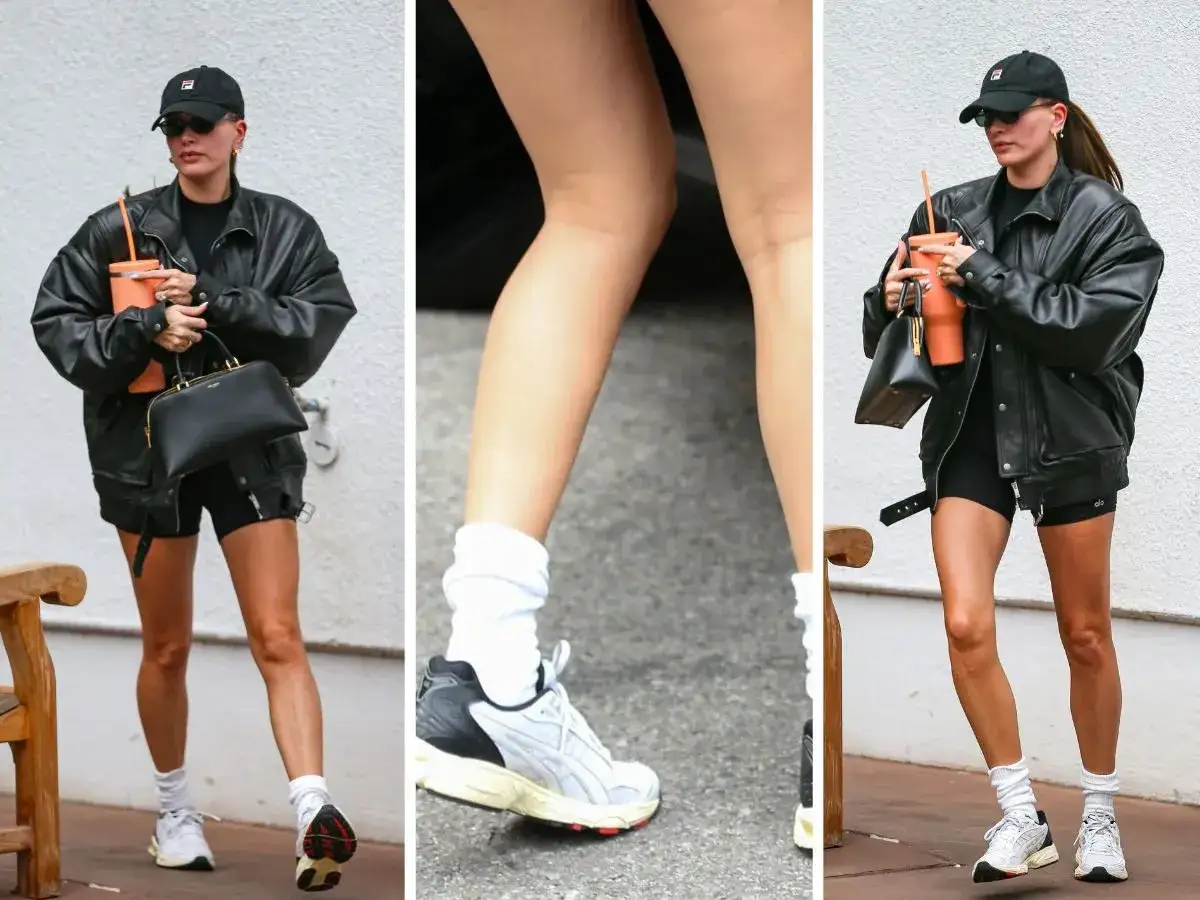 Kobieta w czapce i skórzanej kurtce prezentuje najmodniejsze adidasy damskie. Białe skarpetki i sportowy styl.