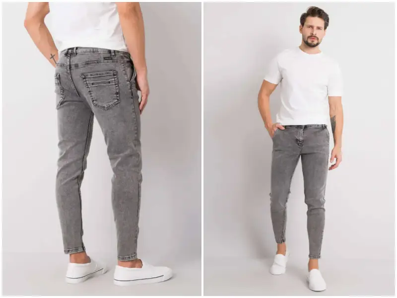 Szare jeansy męskie z przetarciami, dopasowane, z białym t-shirtem i białymi slip-onami.